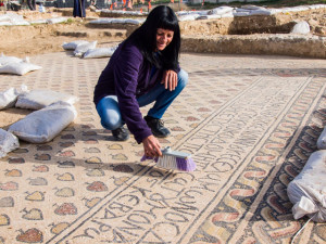 Cleaning the mosaic floor in the prayer hall of a Byzantine monastery in the northern Negev